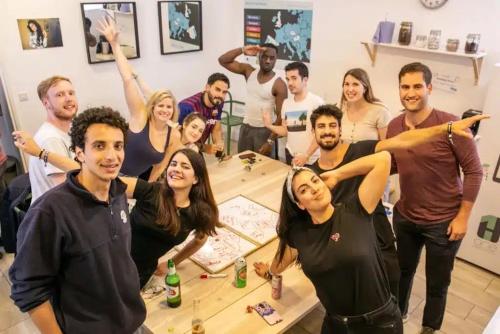 a group of people posing for a picture in a room at Onefam Notting Hill in London