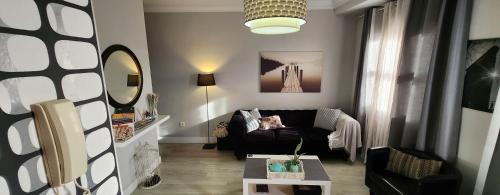 a living room with a couch and a table at El Mirador de Viana in La Laguna