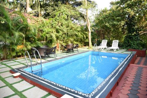 Majoituspaikassa 4BHK Private Pool villa in North Goa and Kayaking nearby!! tai sen lähellä sijaitseva uima-allas