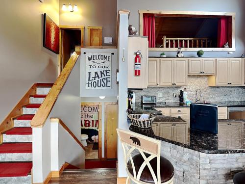 a kitchen with a counter top and a staircase at Our Happy Place in McHenry