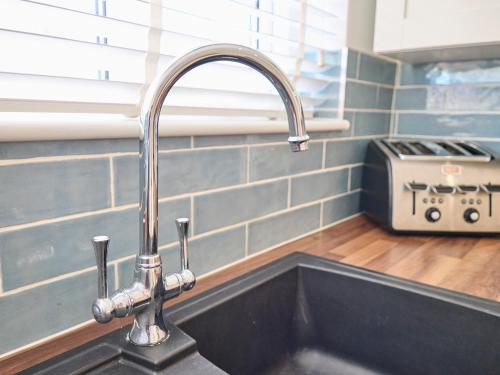 a kitchen sink with a faucet in a kitchen at Host & Stay - Grosvenor House in Margate