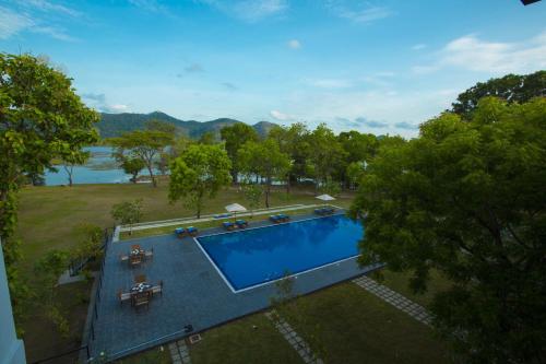 an overhead view of a swimming pool in a yard at Grand Tamarind Lake in Kataragama