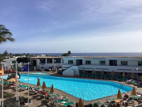 a view of the pool at a resort at ROXY HOME in Puerto del Carmen