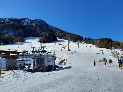 a group of people skiing on a ski slope at Apartments Blažič in Kranjska Gora