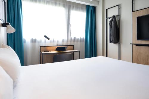 Postel nebo postele na pokoji v ubytování ibis Paris Gare de Lyon Diderot