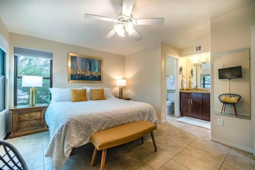 a bedroom with a bed and a ceiling fan at Pools / Hot Tub / 3 Bedroom Condo / Ventana Canyon in Tucson