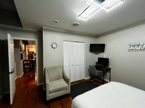 a bedroom with a bed and a chair and a desk at Downtown Albany 1 Bed + Workstation @ Maiden Lane in Albany