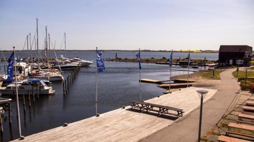 a dock with boats docked in a marina at Hotel Strandtangen in Skive