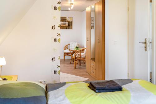 a bedroom with a bed and a dining room at Nice Days in Bad Harzburg