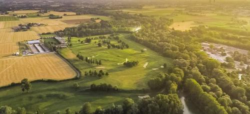 an aerial view of a large green field with trees at Casale IL SAMBUCO sui colli bolognesi in San Lazzaro di Savena