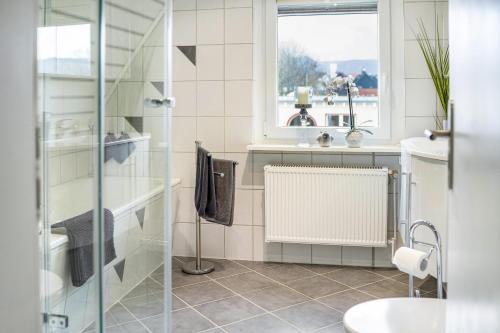 a bathroom with a shower and a sink at Nice Days in Bad Harzburg