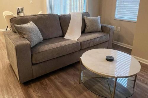 a living room with a couch and a table at New Modern 1 BR in Heart of Midtown in Kansas City