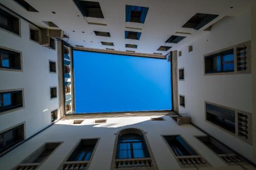 a large blue screen in the middle of a building at Residenza Corso Palladio 159 in Vicenza