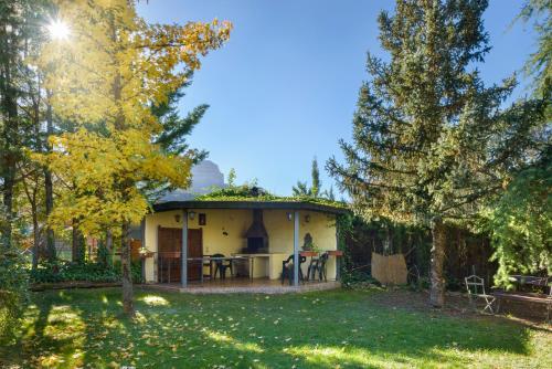 a small house with a patio in a yard at Villa Lana chalet Baros, Jaca in Jaca