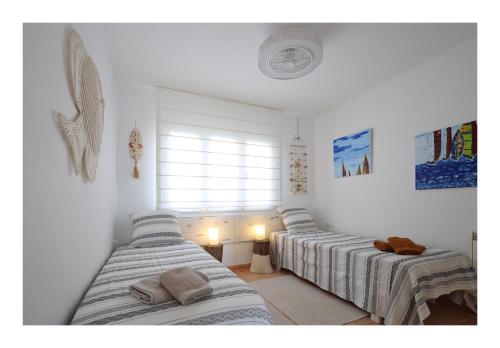 Ένα ή περισσότερα κρεβάτια σε δωμάτιο στο Appartement vue Mer à 300m de la plage - Son Parc