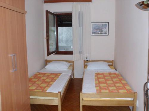 Postel nebo postele na pokoji v ubytování Apartment Maria