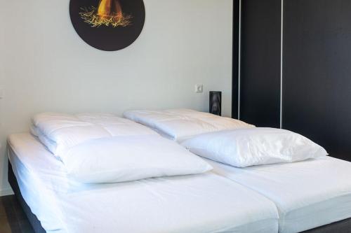 Ένα ή περισσότερα κρεβάτια σε δωμάτιο στο Enkhuizer Strand Chalet Strandjuwel Erste Reihe Hausnr 205