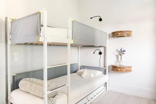 a bedroom with two bunk beds in a room at Boutique house with Pateo in Sintra