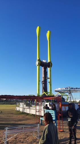 a group of people standing around a playground at Smartie Box in Langebaan