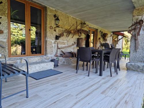 a dining room with a table and chairs at Quinta da Casa dos Santos - Inside Gerês in Geres