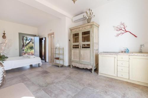 a large room with a bed and a dresser at Ca` della Roccia by Perle di Puglia in Ostuni