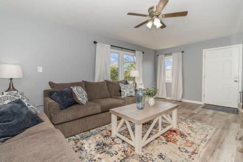 a living room with a couch and a table at New renovated single-family home built in 1999 in Middletown
