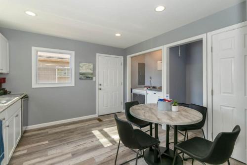 a kitchen and dining room with a table and chairs at New renovated single-family home built in 1999 in Middletown