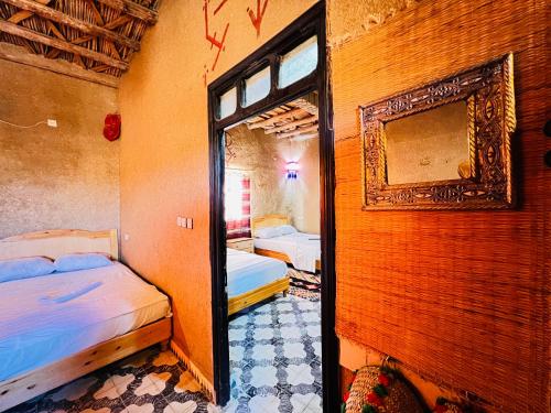 Ένα ή περισσότερα κρεβάτια σε δωμάτιο στο Hotel Camping Les Roses Des Dunes & Piscine