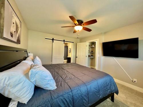 a bedroom with a bed and a ceiling fan at Quaint 4 Bedroom Ranch Home in Mason Ohio in Mason