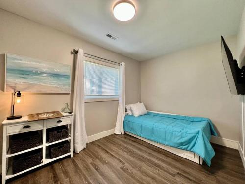 a bedroom with a bed and a window at Quaint 4 Bedroom Ranch Home in Mason Ohio in Mason