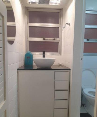 a bathroom with a sink and a toilet at Amadeus in Mendoza