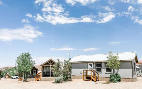a house in the middle of a dirt lot at HTR Moab in Moab