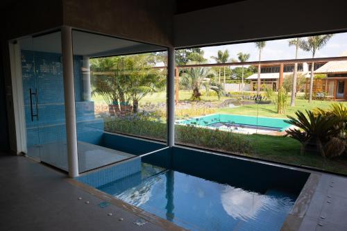 an external view of a house with a swimming pool at Tiradentes Boutique Hotel in Tiradentes