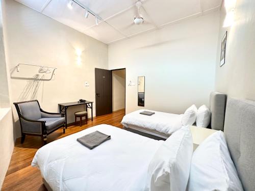 Madras Inn 58-1 tesisinde bir odada yatak veya yataklar