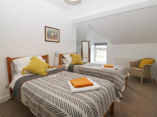 Ένα ή περισσότερα κρεβάτια σε δωμάτιο στο The Bell Apartment