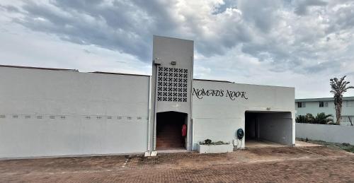 a white building with the door open on it at Nomads Nook 15 in Ramsgate