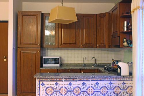 Η κουζίνα ή μικρή κουζίνα στο Delizioso appartamento a Capalbio con vista