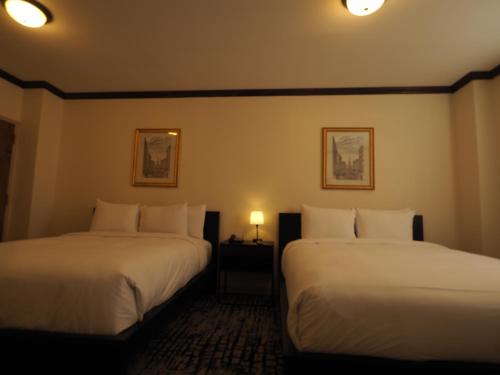 Postel nebo postele na pokoji v ubytování Night Hotel Broadway