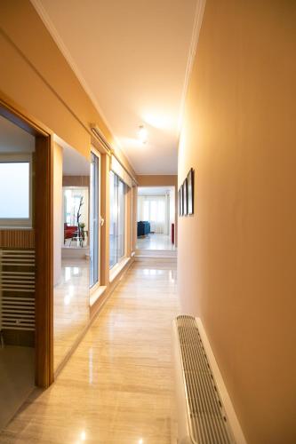 a hallway of a house with a bench on the wall at AKAKIA VILLA NAFPLIO in Nafplio