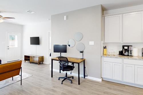 a room with a desk with a computer and a chair at Serenity House on Kingwood in Porter