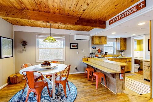 a kitchen and dining room with a table and chairs at Bryson Chalet in Bryson City
