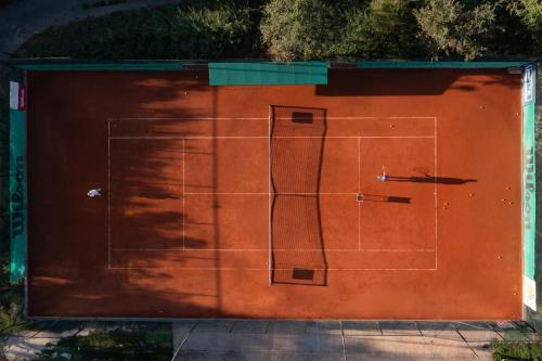 a garage with a tennis court on it at Nafsika Hotel - Adults Only in Dassia