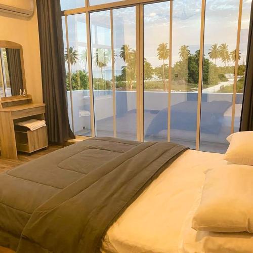 Una cama o camas en una habitación de Shitha Inn