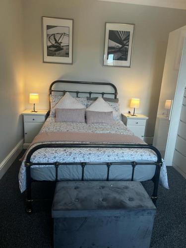 a bedroom with a bed with pillows and two lamps at Matipa-Given Apartments Eastleigh Southampton in Eastleigh