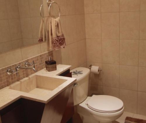 a bathroom with a toilet and a sink at Playa Flamingo - 2 BR condo with great ocean views - FLAMINGO TOWERS 25 in Playa Flamingo