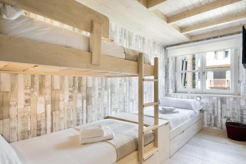Posteľ alebo postele v izbe v ubytovaní Luderna - Apartamento Val de Ruda B24 des Garguills