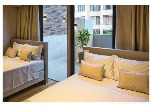 Cama ou camas em um quarto em Life Residence