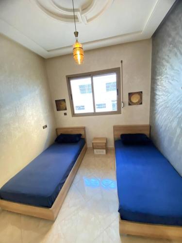 Una cama o camas en una habitación de Appartement calme