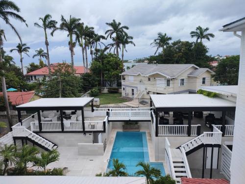 an aerial view of a house with a swimming pool at The Great House Inn in Belize City