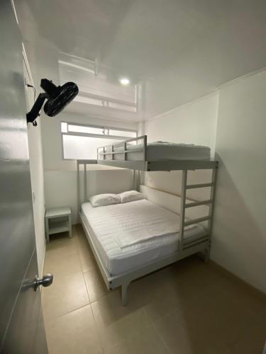 Ένα ή περισσότερα κρεβάτια σε δωμάτιο στο Hotel Paraíso Real NB